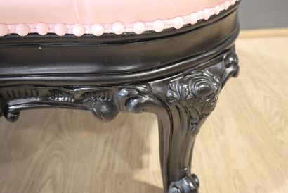 PAUL ART. Banquette en bois noirci et garniture...