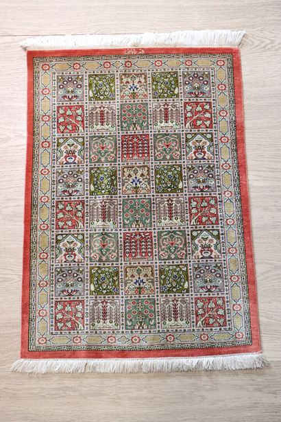 Wool and silk carpet decorated with stylized...