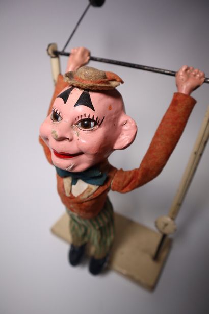 Paper maché acrobat clown and pendulum. Height:...