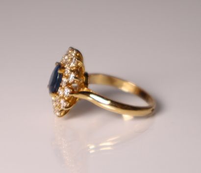 Yellow gold daisy ring set with a sapphire...
