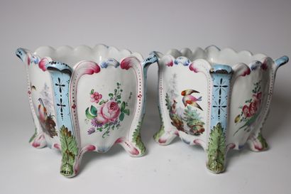 Pair of earthenware pot covers decorated...