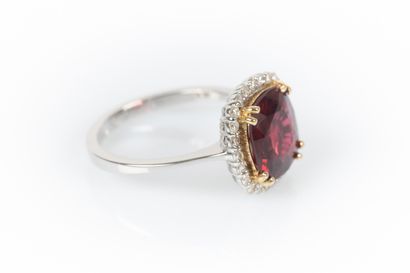 Two-tone gold ring set with a cushion-shaped...