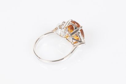 White gold ring set with an oval citrine...