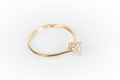 Yellow gold solitaire set with a pear-shaped...