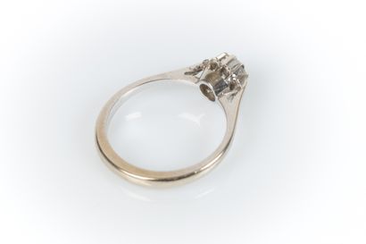 White gold solitaire set with a round modern-cut...