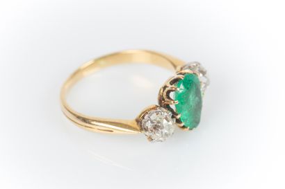 Two-tone gold ring set with a drop emerald...