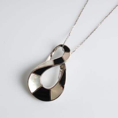 Solid silver pendant with a tendril of onyx...