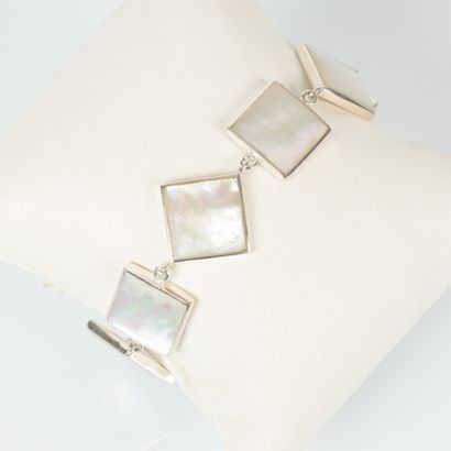 Silver bracelet with square design set with...