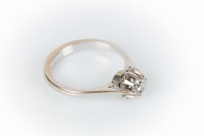 White gold solitaire set with a round modern-cut...