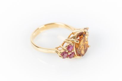 Yellow gold ring set with an oval-cut Citrine...