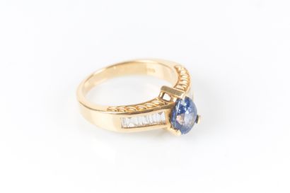 Yellow gold ring centered with a pear-shaped...