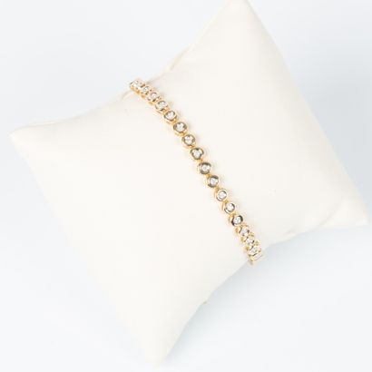 Line bracelet in yellow gold set with 40...