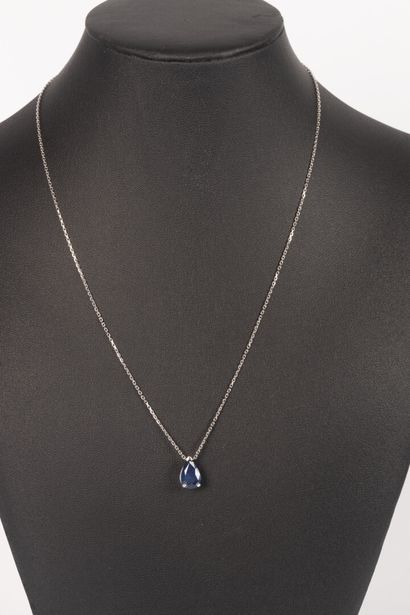 White gold necklace set with a pear-cut sapphire...