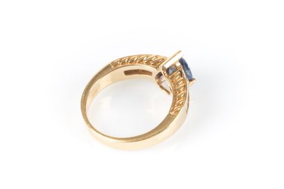 Yellow gold ring centered with a pear-shaped...