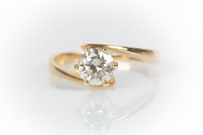. Yellow gold solitaire set with a diamond...