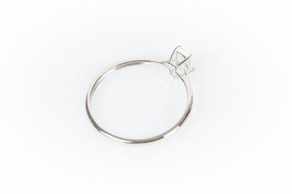 White gold solitaire set with a baguette...