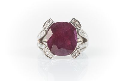 White gold jewelry ring centered with a large...