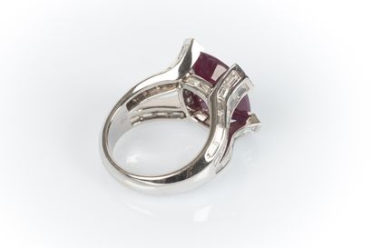 White gold jewelry ring centered with a large...