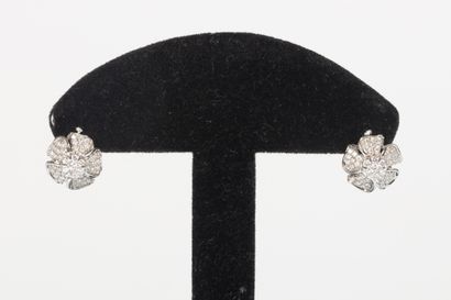 Pair of white gold flower earrings set with...