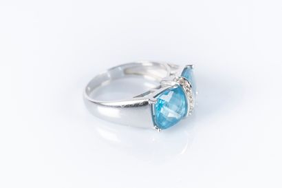 9k white gold ring set with two faceted topazes...