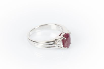 Ring in white set with an oval-cut Burmese...