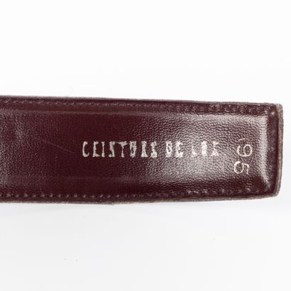CARTIER. Belt in smooth burgundy leather,...