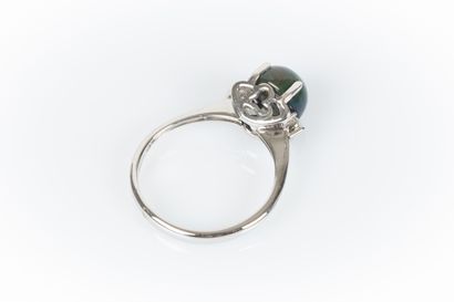 White gold ring set with a round cabochon...