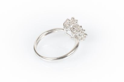 White gold flower ring set with round diamonds....