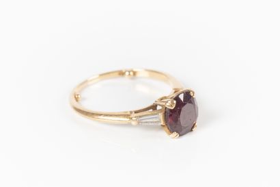 BOUCHERON. Gold ring set with an oval ruby...