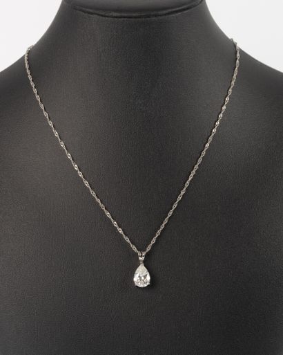White gold pendant set with a pear-cut diamond...