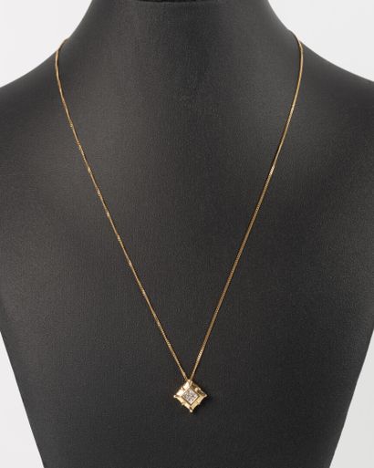 Square gold pendant set with 4 princess-cut...
