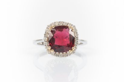 Two-tone gold ring set with a cushion-shaped...