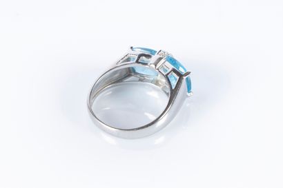 9k white gold ring set with two faceted topazes...