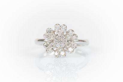 White gold flower ring set with round diamonds....