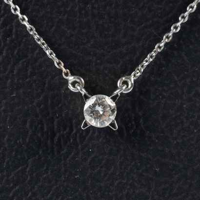 White gold necklace set with a diamond weighing...