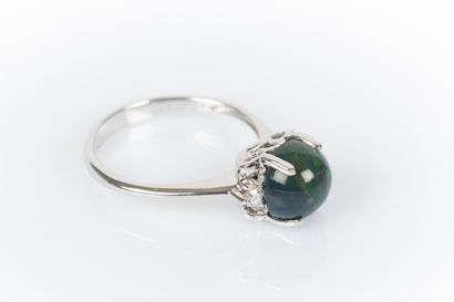 White gold ring set with a round cabochon...