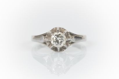 Gold and platinum solitaire ring set with...