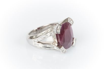 White gold jewelry ring centered with a large...