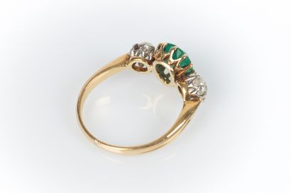 Two-tone gold ring set with a drop emerald...