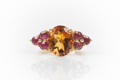 Yellow gold ring set with an oval-cut Citrine...