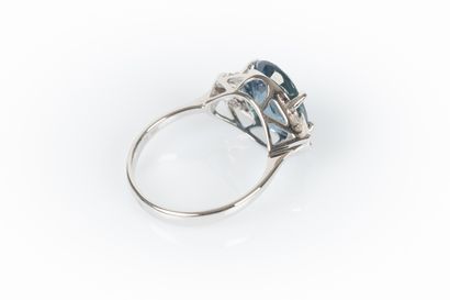 White gold ring set with a natural oval sapphire...