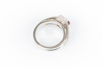 White gold ring set with an oval ruby weighing...