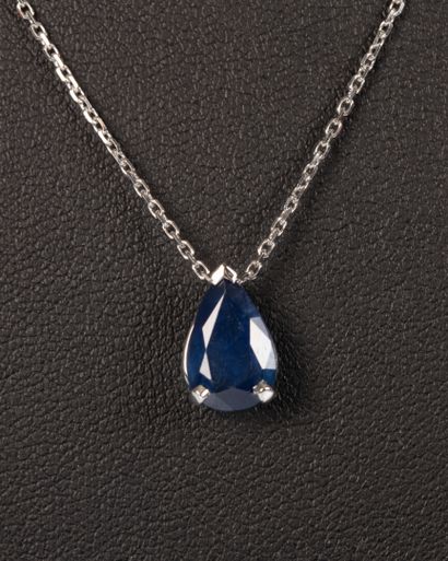 White gold necklace set with a pear-cut sapphire...