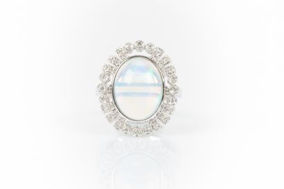 White gold ring set with an oval cabochon...