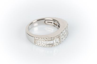White gold ring set with 9 princess-cut diamonds...