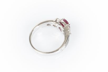 Ring in white set with an oval-cut Burmese...