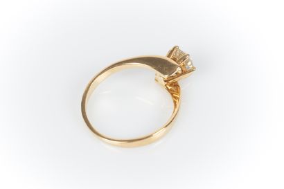 . Yellow gold solitaire set with a diamond...