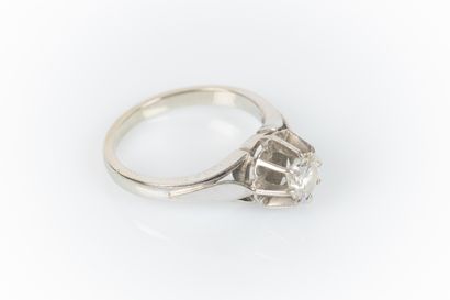 Gold and platinum solitaire ring set with...