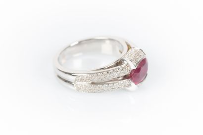 White gold ring set with an oval ruby weighing...