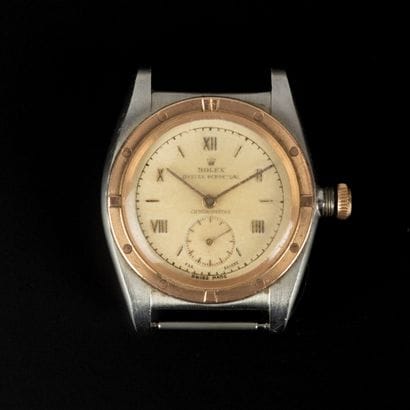 ROLEX circa 1950. Steel and 9k gold watch...